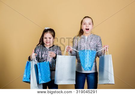 Pay Less. Girls Sisters Friends With Shopping Bags Beige Background. Shopping And Purchase. Black Fr