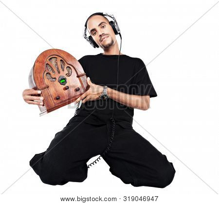African musician singer with headphones holding a vintage radio