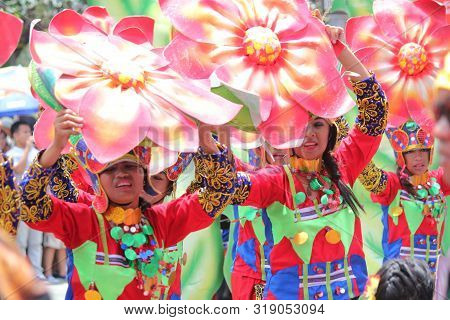 Davao City, Philippines-august 2014: Parade Participants Dance To The Beat Of The Drums At The Stree