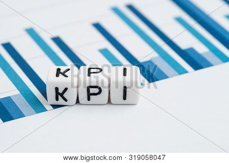 Kpi, Key Performance Indicator Concept, Small Cube Block With Alphabets Building The Word Kpi On Yea
