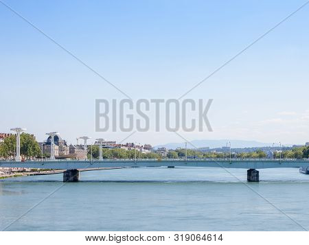 Pont De La Guillotiere Bridge In Lyon, France Over A Panorama Of The Riverbank Of The Rhone River (q
