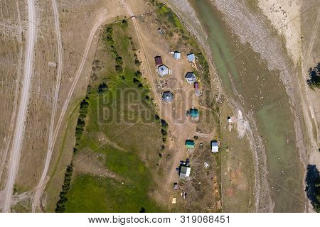 Aerial View Of A Settlement In The Altai Mountains With Small Houses For Indigenous People And Touri