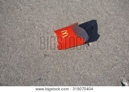 Joliet, Illinois / United States - December 2, 2017: A Discarded Red Mcdonalds French Fry Box Lies O