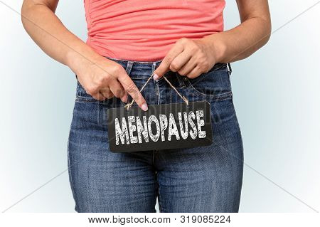 Menopause, Feminine Hygiene. Women Holds Blackboard With Teht In Front Of Intim Body Parts