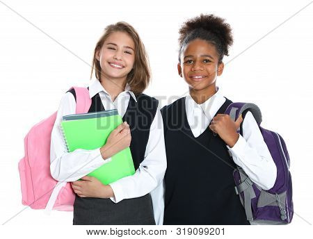 Happy Girls In School Uniform On White Background