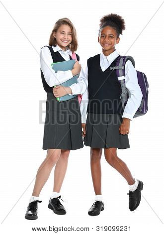 Happy Girls In School Uniform On White Background