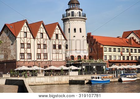Kaliningrad, Russia - August 24, 2019: View Of The Fish Village And Lighthouse On The Embankment Of 
