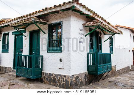 Duitama, Colombia - August, 2019: Beautiful Facades Of The Houses At The Touristic Place Called Pueb