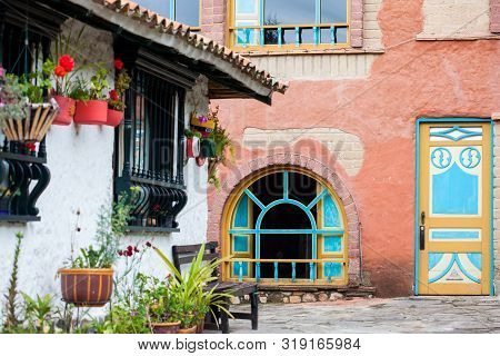 Duitama, Colombia - August, 2019: Beautiful Facades Of The Houses At The Touristic Place Called Pueb