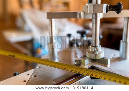 Underpinner On Focus, Picture Framer Tool In A Small Workshop, Shallow Depth Of Field.