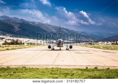 Modern passenger plane at airport lane moving to take off , Cusco , Peru. South Amerca.