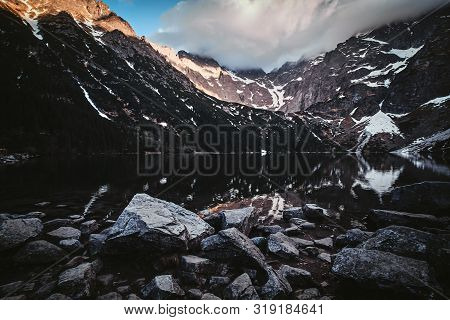 Spectacular View To The Beautiful Mountains With Mirroed Reflection And Clouds At Sunrise Time.