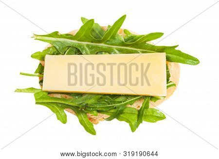 Top View Of Open Sandwich With Fresh Bread, Cheese And Green Arugula Leaves Isolated On White Backgr