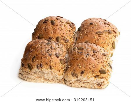 Wholemeal  Multiseeds Batch Rolls Isolated On White Batch Of Four