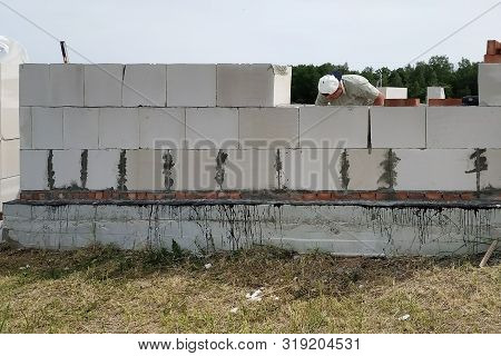 Laying The Wall Of Gas Blocks With Tools And Glue.
