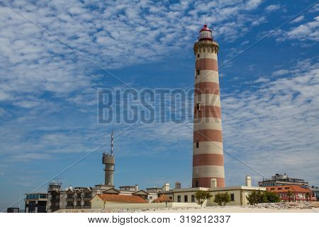 The Lighthouse of Praia da Barra, also known as the Aveiro Lighthouse - Portugal.