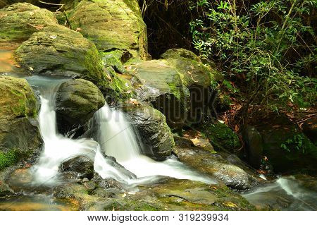 Water Flowing Over Rocks At Khao Ito Waterfall,prachin Buri City,thailand.
