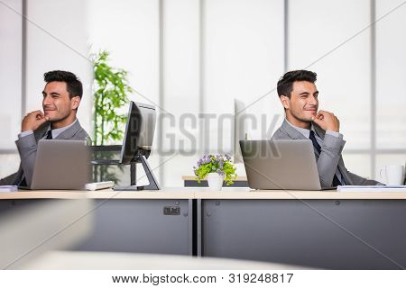 Smiling Handsome Caucasian Businessman In Black Suit Support The Chin And His Shadow Is Reflected In