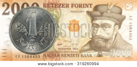 1 Hungarian Forint Coin Against A New 2000 Hungarian Forint Banknote Indicating Growing Economics Wi