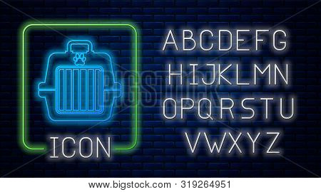 Glowing Neon Pet Carry Case Icon Isolated On Brick Wall Background. Carrier For Animals, Dog And Cat