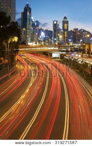 Night Traffic And Skyline Of Hong Kong City At Dusk