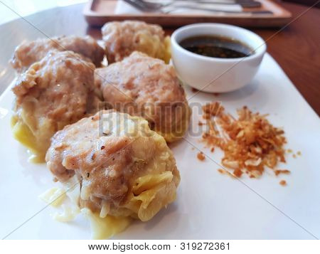 Chinese Food Style, Selective Focus Of Pork Chinese Steamed Dumpling With Deep Fried Garlic And Soy 