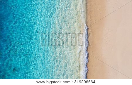 Beach And Ocean As A Background From Top View. Azure Water Background From Top View. Summer Seascape