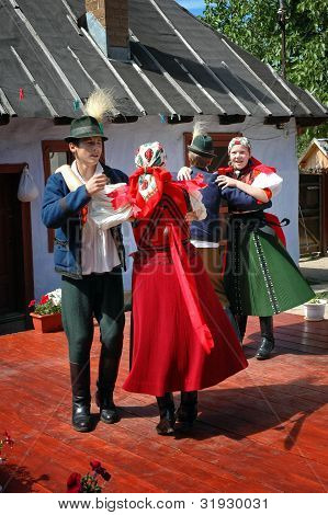 Young dancers in traditional clothe participate at a wedding