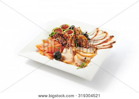 Fish platter with pink salmon, grilled eel, oil fish balyk and red caviar on elegant restaurant plate isolated on white background. Exquisite serving thin slices of salted and dried delicious seafood