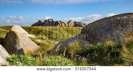 Small watchouse surrounded by the rocks in Kerlouan, Brittany, France