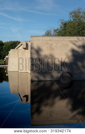 Waterloopbos, The Netherlands, August 25, 2019: The Concrete National Monument, Reflecting In The Su
