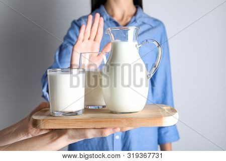 Woman Refusing To Drink Milk, Closeup. Food Allergy Concept