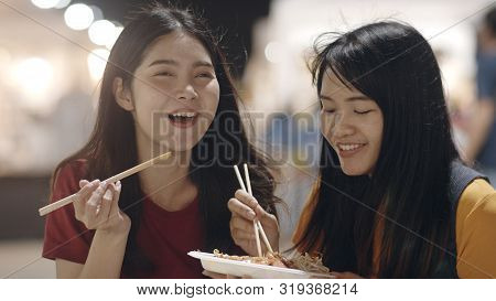 Asian Young Women Friends Travel In Bangkok, Thailand, Beautiful Female Feeling Happy Walking And Ea