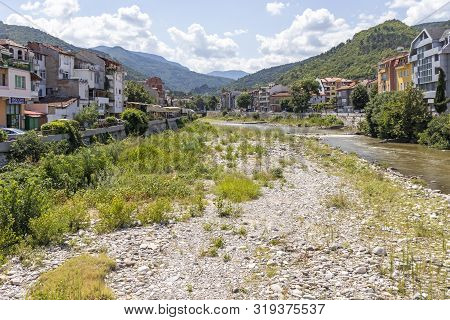 Asenovgrad, Bulgaria - August 5, 2019: Chepelarska (chaya) River Passing Through The Town Of Asenovg