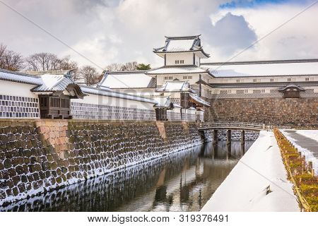 Kanazawa, Japan at the castle in winter with snow.