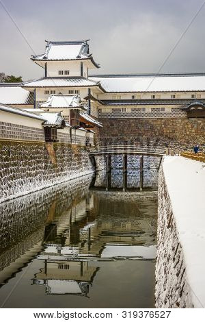 Kanazawa, Japan at the castle in winter with snow.