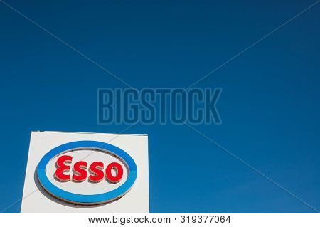 Lyon, France - February 26, 2019: Esso Logo On Its Gas Service Station In Lyon, France On Blue Sky B