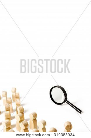 A Crowd Of People Looking Into A Magnifying Glass. Search And Tracing Concept, Finding Out The Truth