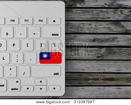 Taiwan (republic Of Cina) Flag Enter Key On White Keyboard, On Wood Background. 3d Render