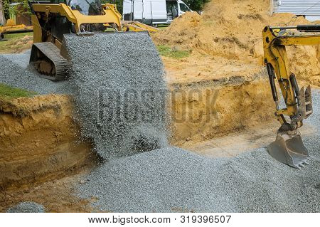 Excavator Bucket Backfilling Trench For Stone Backfill Of Foundation Excavator Bucket Working