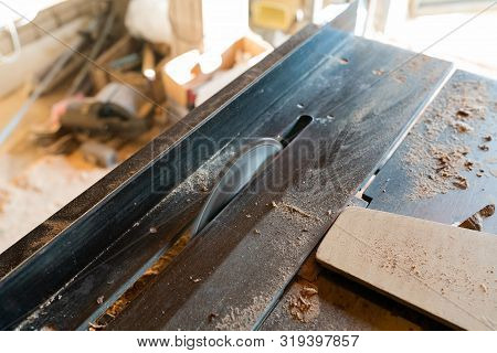 Working Woodworking Machine With Circular Saw. Selective Focus. Manual Wood Processing Concept.