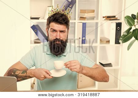 Man Bearded Manager Businessman Entrepreneur Wear Golden Crown On Head. Relaxed Top Manager Drinking