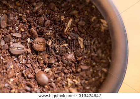 Coffee Beans Are Ground Into Coffee Powder By A Grinder