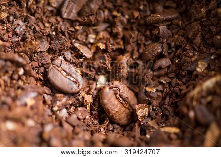 Coffee Beans Are Ground Into Coffee Powder By A Grinder