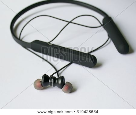 Modern Headphones For The Phone. Magnetic Earphones. Portable Headset For Phone. Audio.
