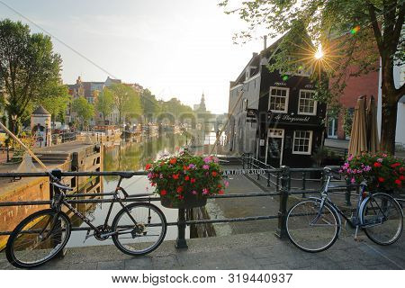 Amsterdam, Netherlands - July 17, 2019: Sint Antoniesluis Lock, Overlooking Oudeschans Canal, With A