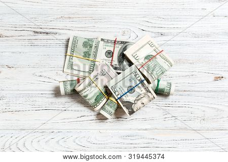 Stacks Of One Hundred Dollars Banknotes Close-up On Colored Background Business Concept Top View Wit