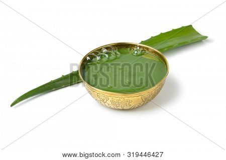Green Savon noir, black soap, with Aloe extract and fresh Aloe leaf isolated on white background