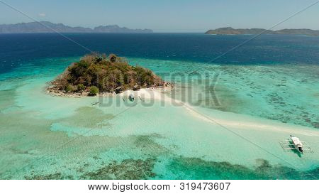 Aerial Seascape Tropical Island And Sand Beach, Turquoise Water And Coral Reef. Malacory Island, Phi