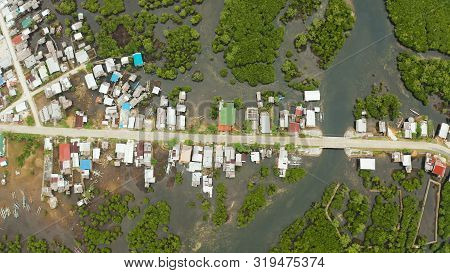 Rural Road In The Philippines In The Mangroves And The Village With Houses Top View. Siargao Island,